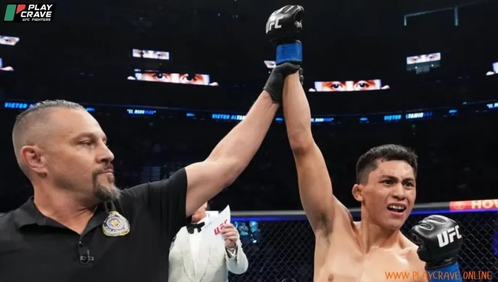 An MMA fighter raising his hand inside the octagon after winning the match