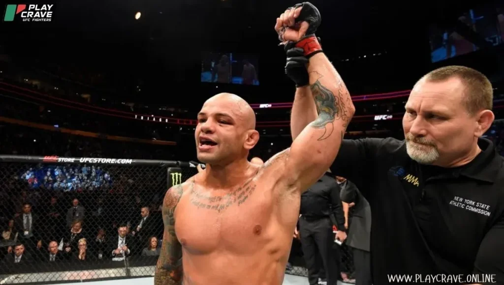 An MMA fighter raised his hand after a stunning win