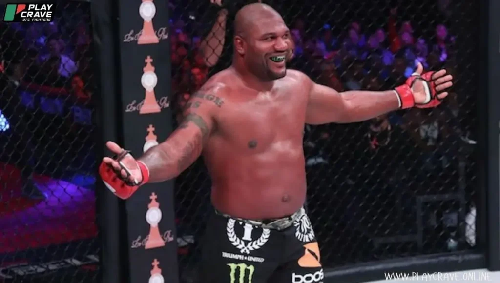 An MMA champion raising his hands after winning the match