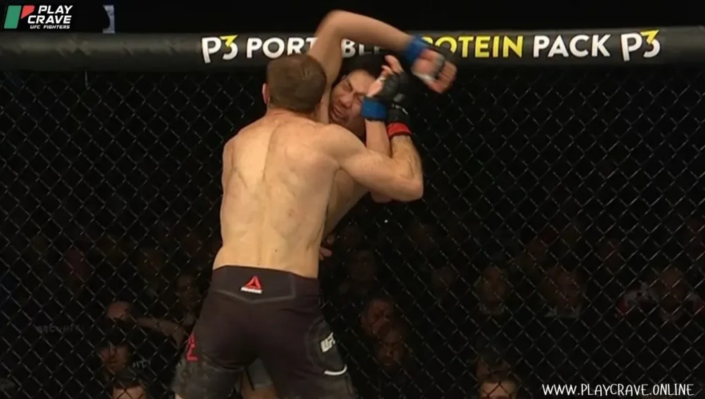 Sultan Aliev fighting in the UFC octagon